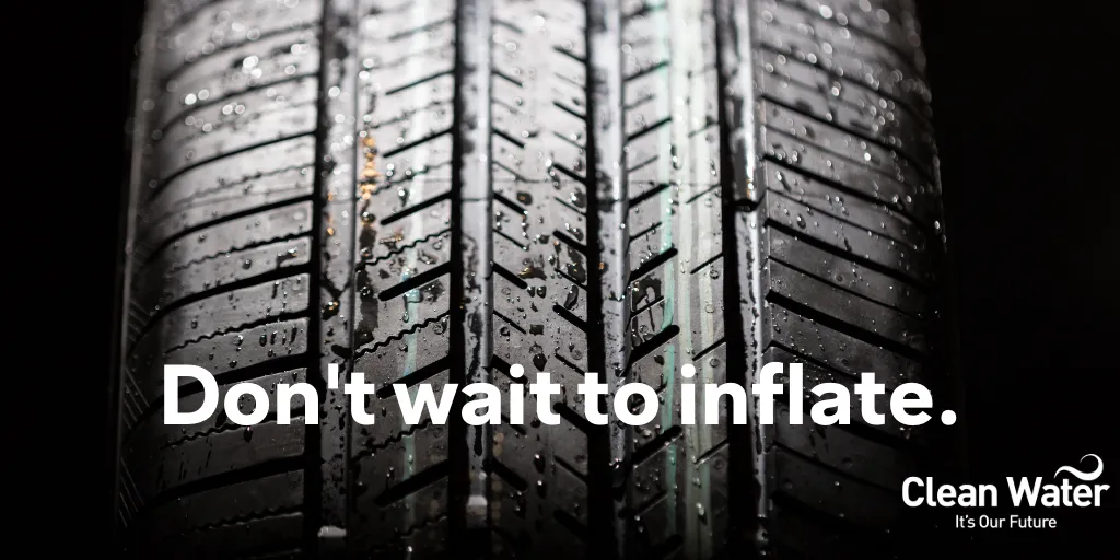 Close-up photograph of a car tire against a black background with text across the image, “Don’t wait to inflate”.